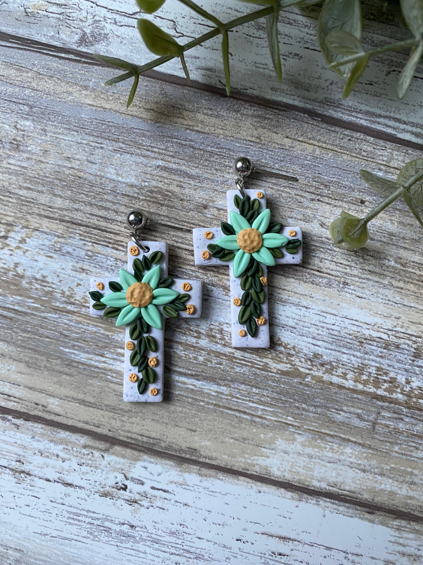 Aquamarine floral cross earrings