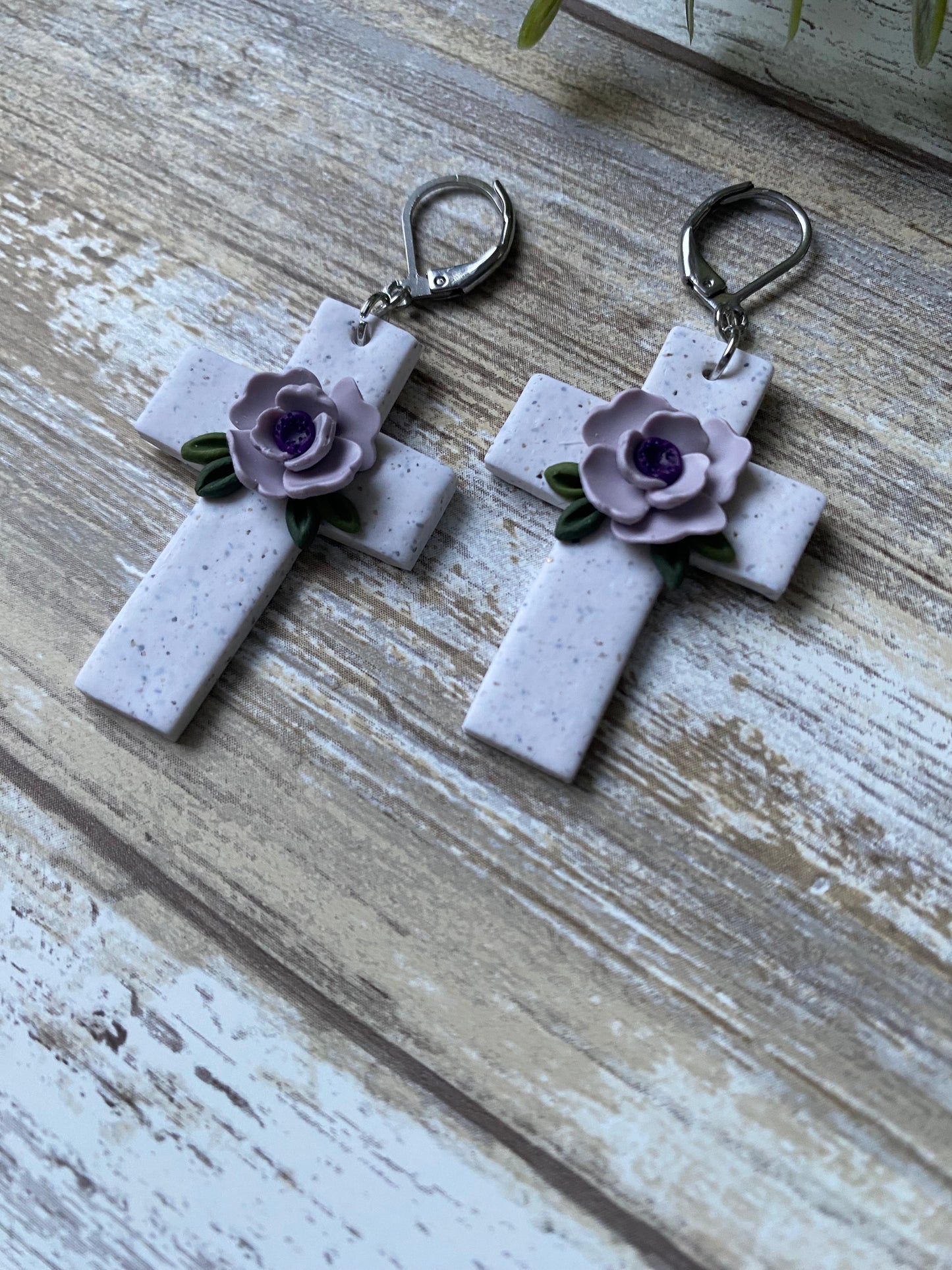 Lilac floral cross dangles with lever back hook