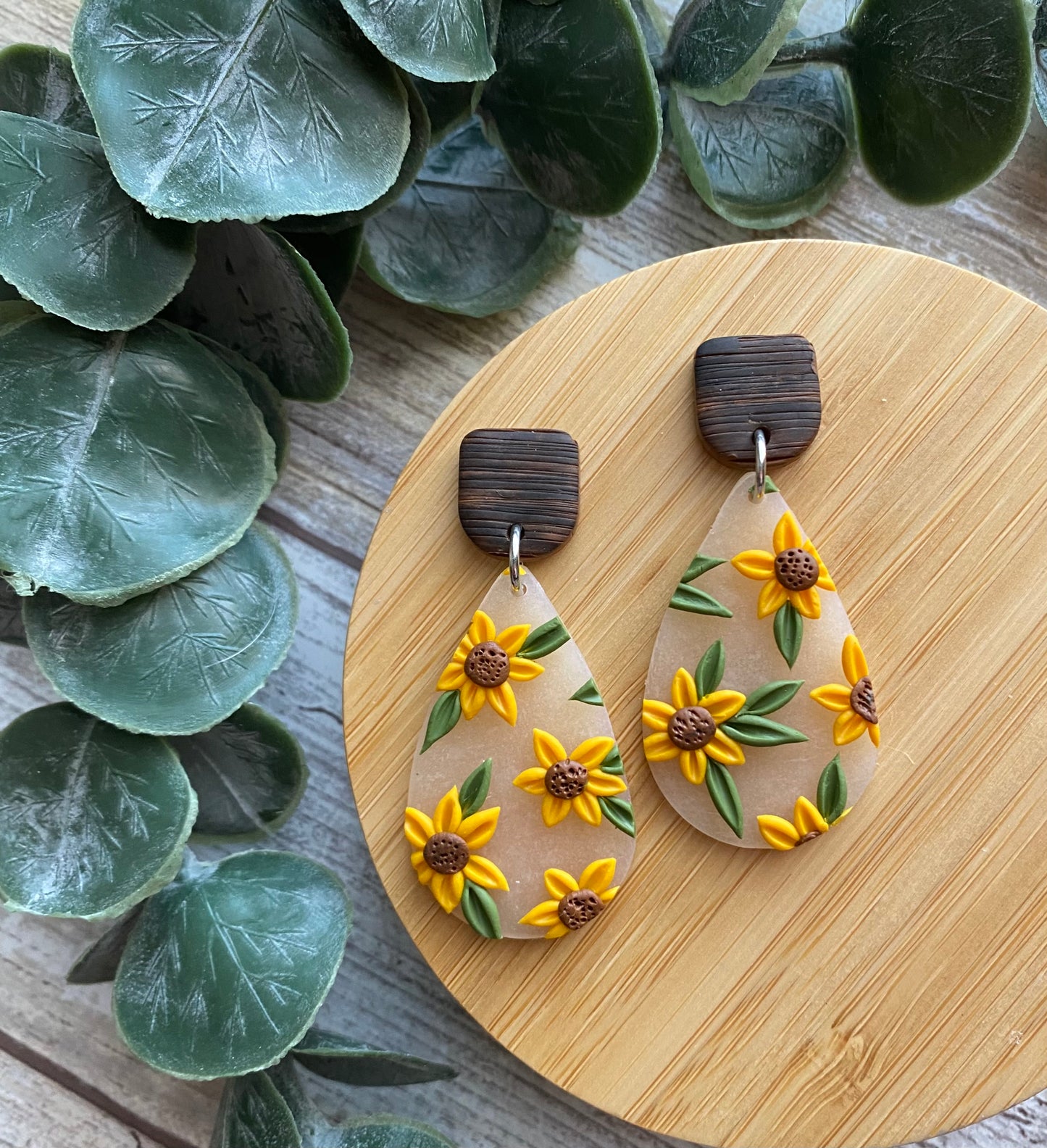 Frosted 1.5” teardrop dangles with sunflowers, faux wooden stud