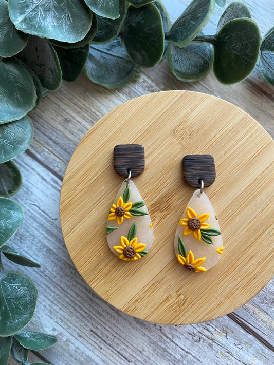 Frosted 1” teardrop dangles with sunflowers, faux wooden stud