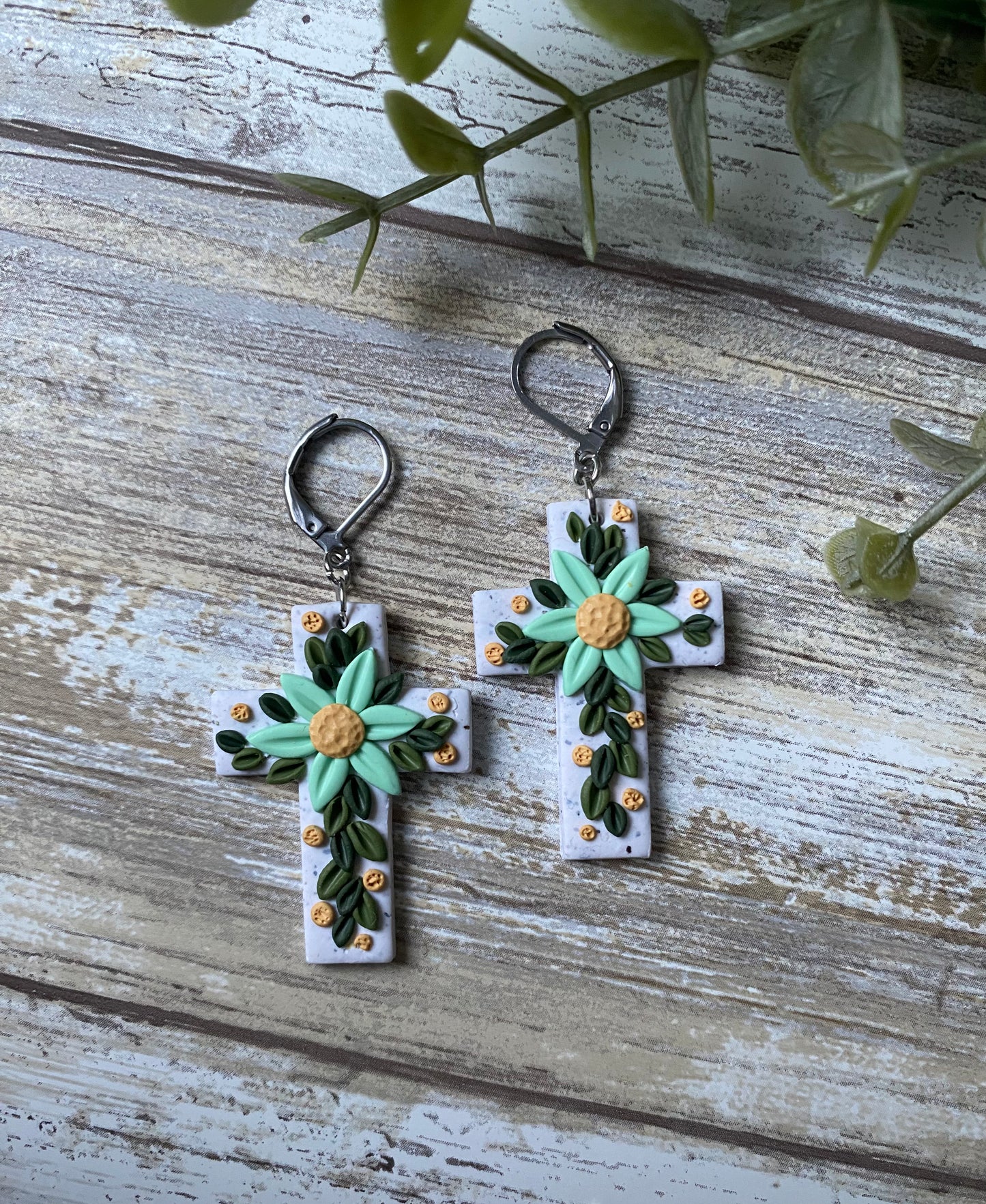 Aquamarine floral cross earrings
